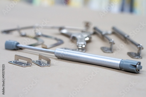 Fasteners for shelf display.Fittings for furniture. Closers, fasteners for furniture, drawers and cabinets.