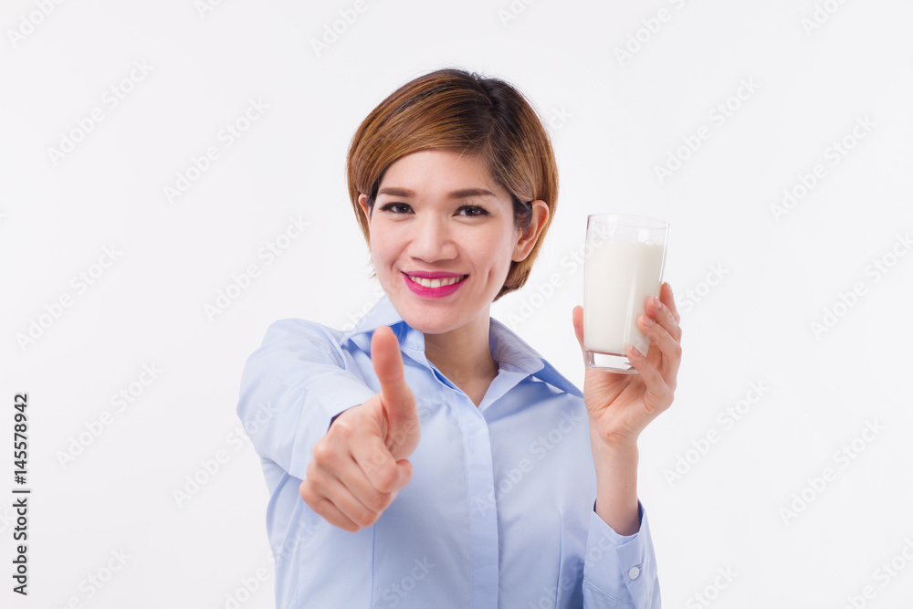 healthy asian woman holding milk, showing thumb up healthy asian woman holding milk, showing thumb up