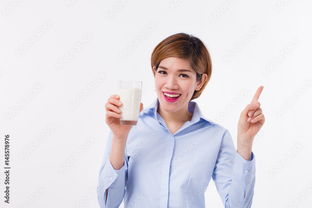 healthy asian woman holding milk, pointing up healthy asian woman holding milk, pointing up