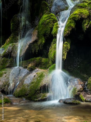 Cheile Nerei Beusnita waterfall in the National Park Nera Gorges in the Carpathian Mountains Romania