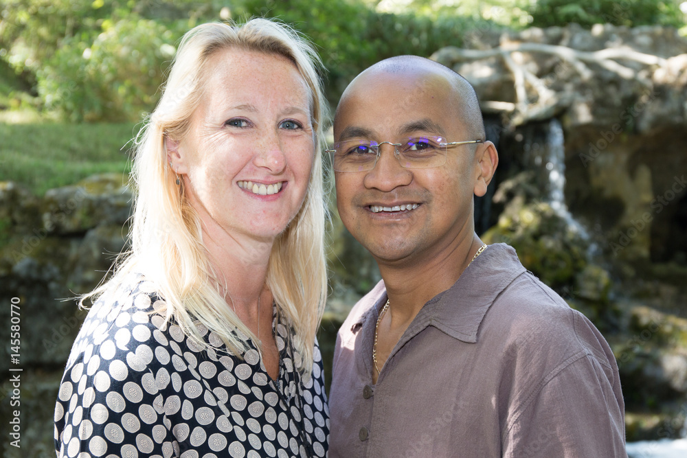 a blonde woman with blue eyes with her husband of Indian origin a blonde woman with blue eyes with her husband of Indian origin