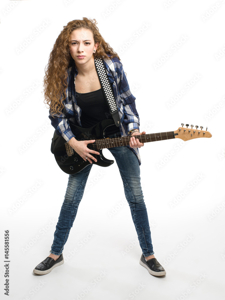 Young guitarist girl posing on white background;
