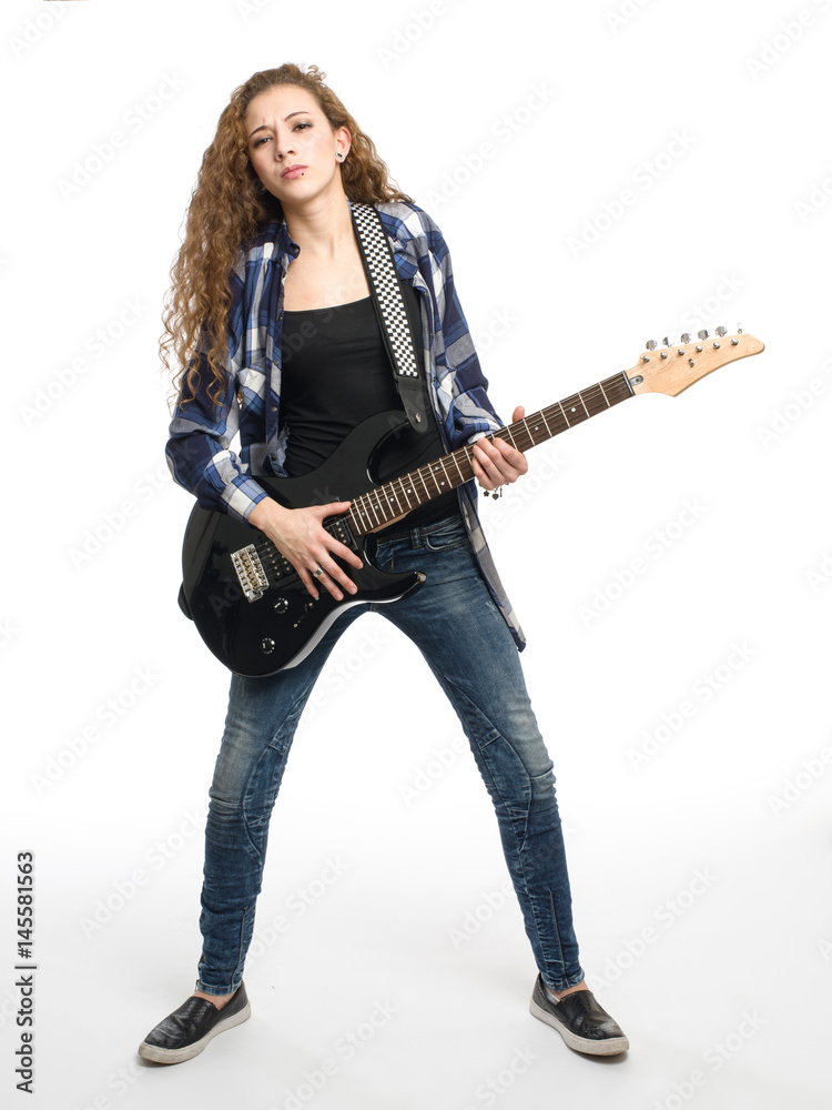 Young guitarist girl posing on white background; Young guitarist girl posing on white background;