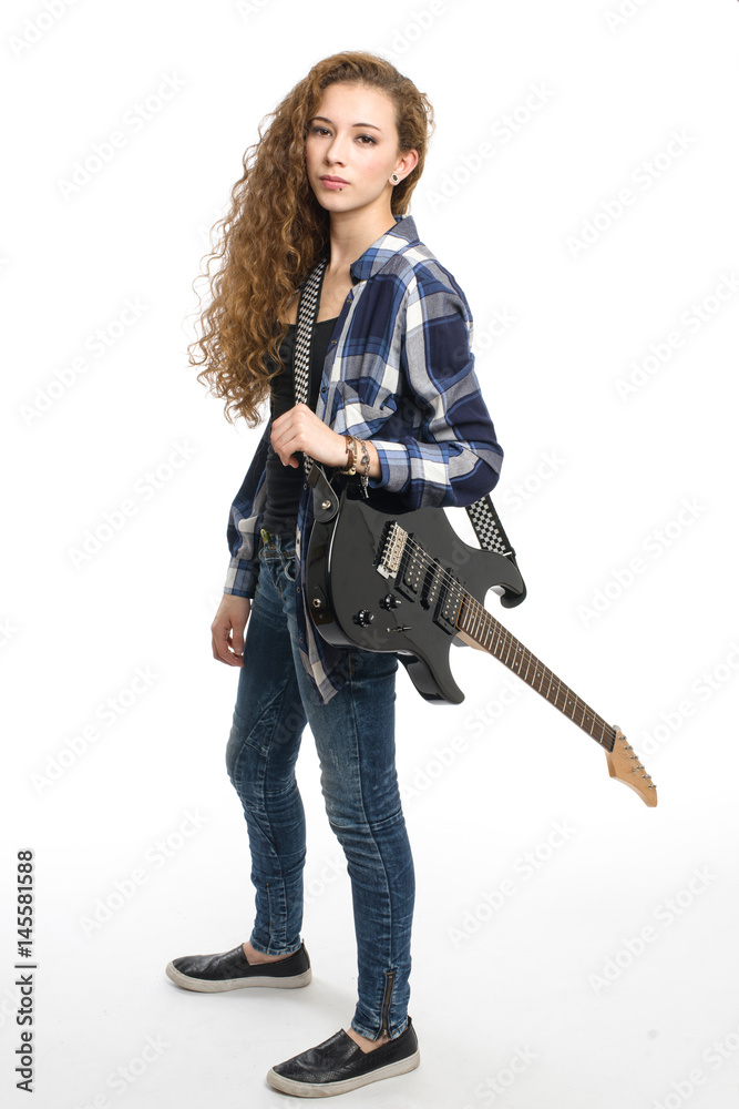Young guitarist girl posing on white background; Young guitarist girl posing on white background;