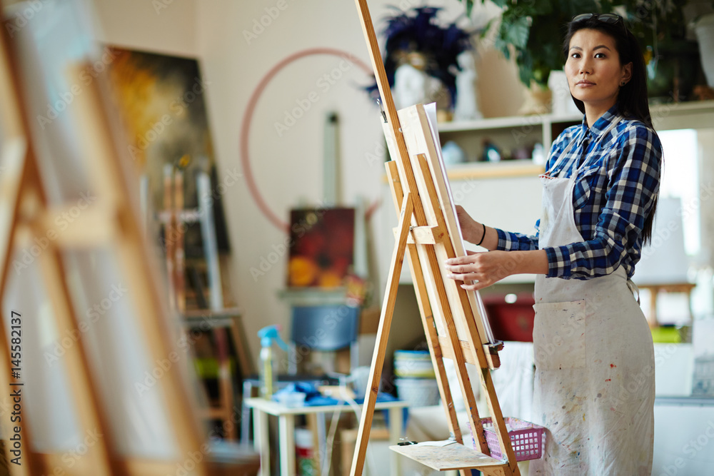 Fototapeta premium Talented girl studying in modern school of arts and painting