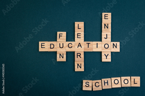 Wood block educaiton word over backboard school. Education word formed by educational wood block. Education word concept for background. photo