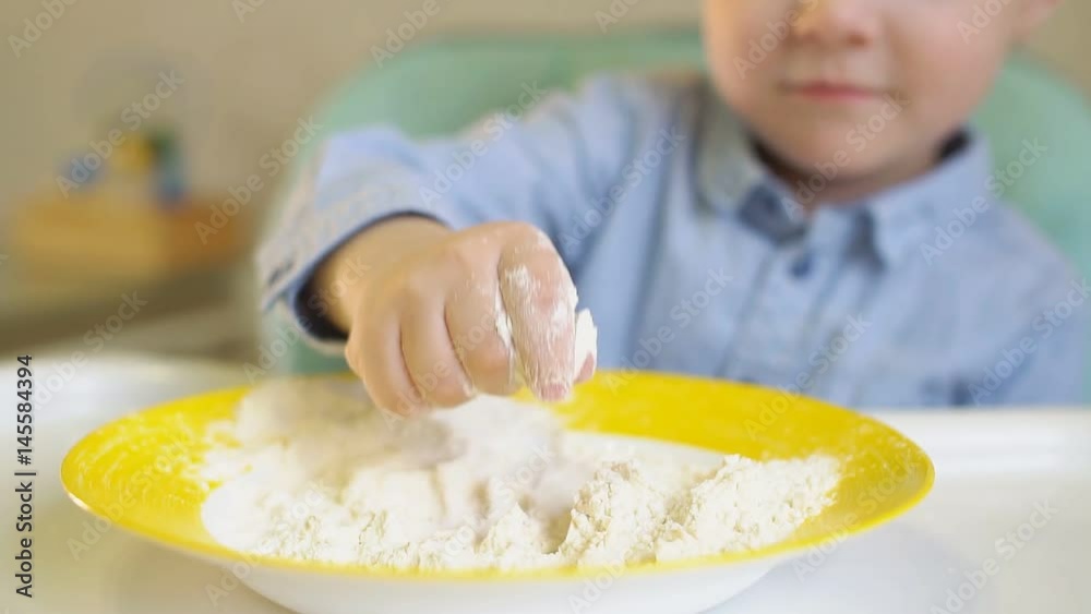 Little Boy Playing With Flour in The Kitchen, Slow Motion Little Boy Playing With Flour in The Kitchen, Slow Motion