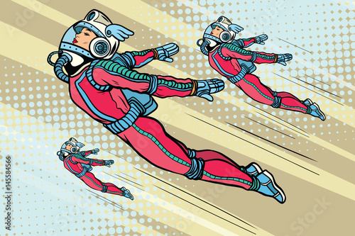 Obraz lecące dziewczyny superbohaterki w futurystycznych skafandrach kosmicznych