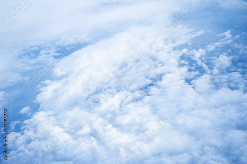 Fototapeta Naklejka Na Ścianę i Meble -  Clouds and sky as seen through window of an aircraft.