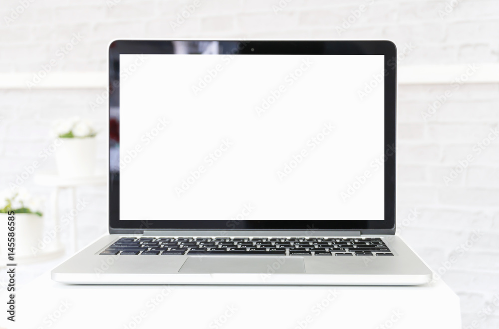 Laptop on white table in office room. for graphics display montage. Laptop on white table in office room. for graphics display montage.