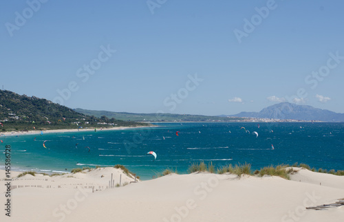 Kitesurfers off Valdevaqueros beach near Tarifa, Spain