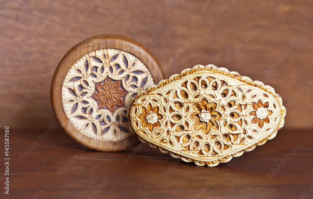 Items decorated with carved birch bark on a wooden background Items decorated with carved birch bark on a wooden background