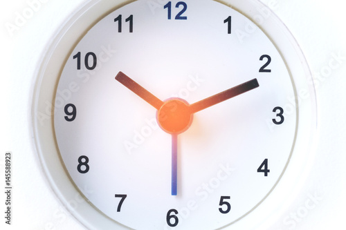 Close up image of white modern clock at 10.10 a.m