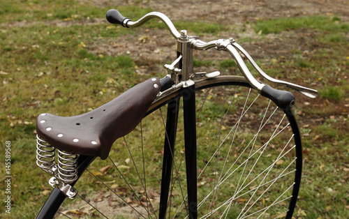 Canvas Print penny-farthing bicycle in a park