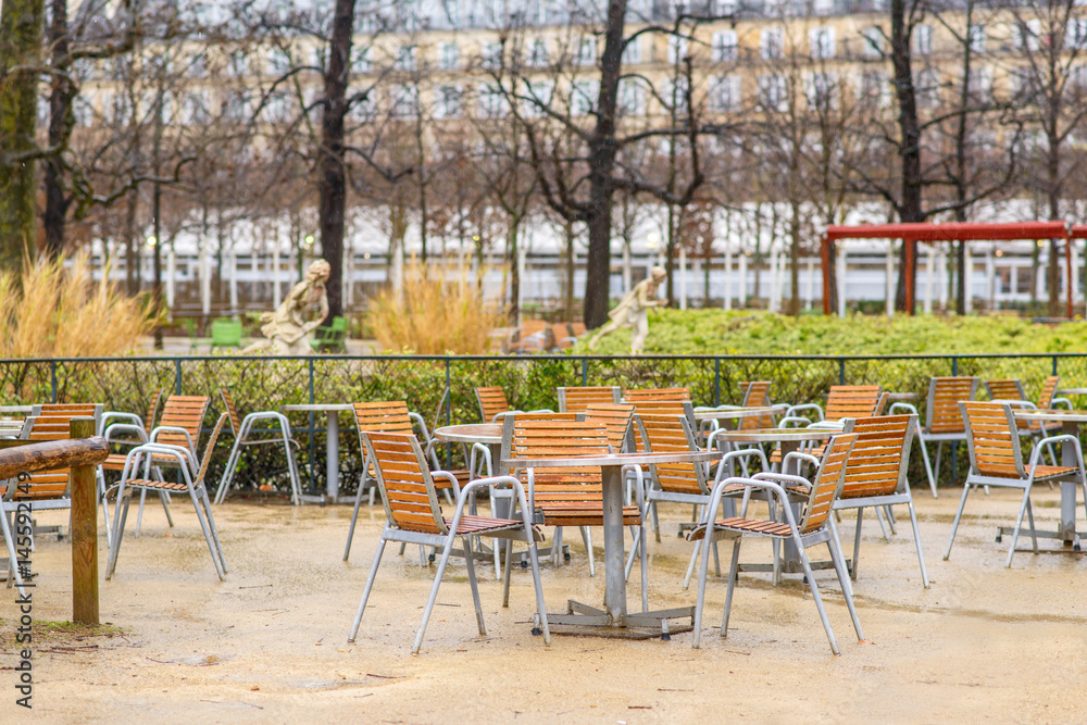 Tables in an open cafe in the park of Paris. Luxembourg Garden