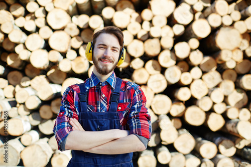 Tree service worker in protective headphones photo