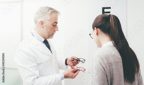 Woman choosing a pair of glasses