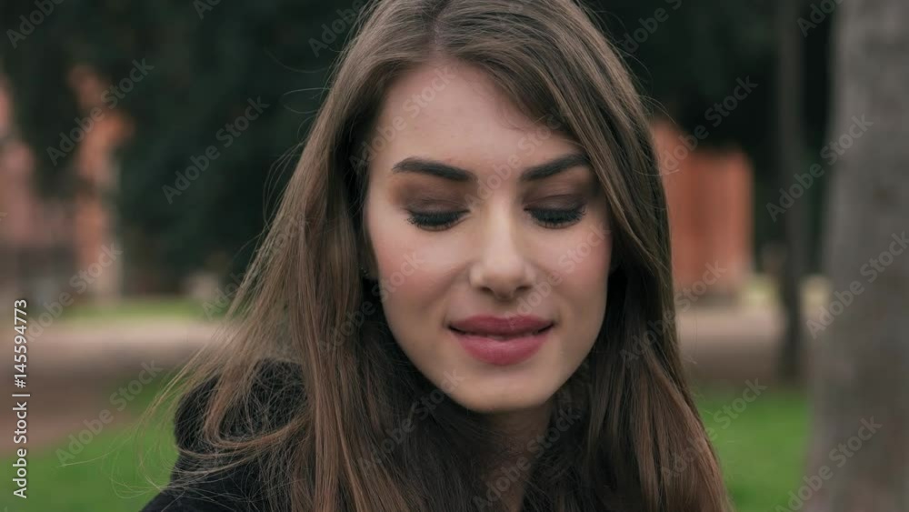 Portrait of beautiful and sensual woman smiling at the camera, outdoor Portrait of beautiful and sensual woman smiling at the camera, outdoor
