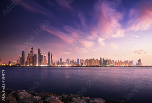 Canvas Print panorama of skyscrapers in Dubai Marina, sunset time, UAE