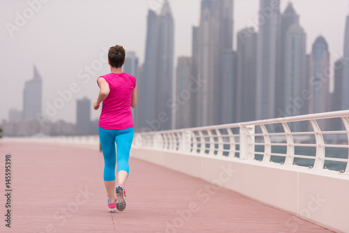 woman running on the promenade