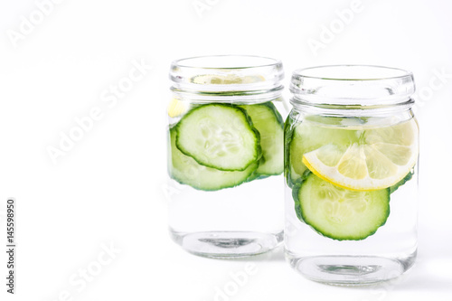 Detox water with cucumber and lemon isolated on white background