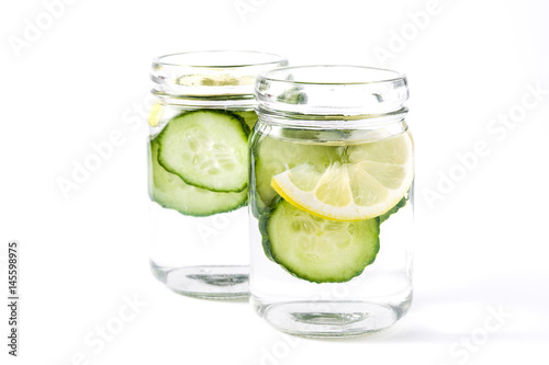 Detox water with cucumber and lemon isolated on white background