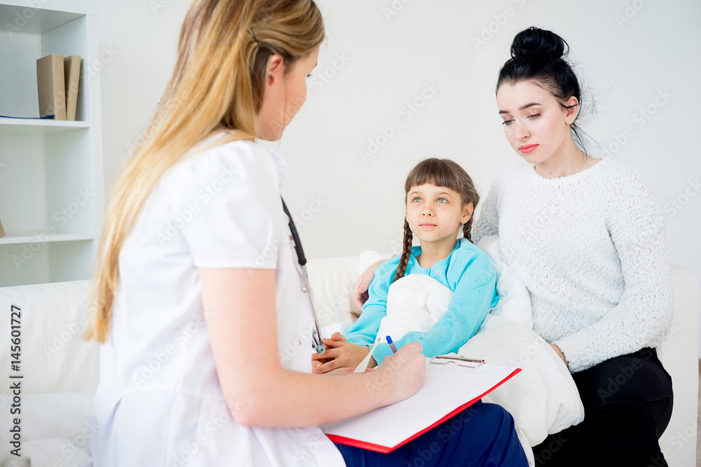 Fototapeta premium Doctor visiting sick girl