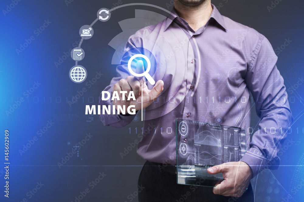 Business, Technology, Internet and network concept. Young businessman working on a virtual screen of the future and sees the inscription: Data mining
