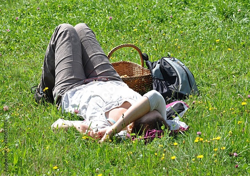 Woman relaxes on a meadow
