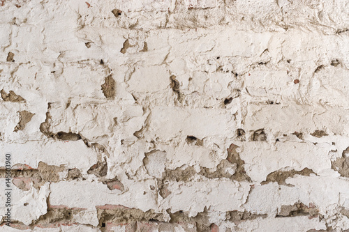 Grungy vintage wall with stone old stucco aged background.