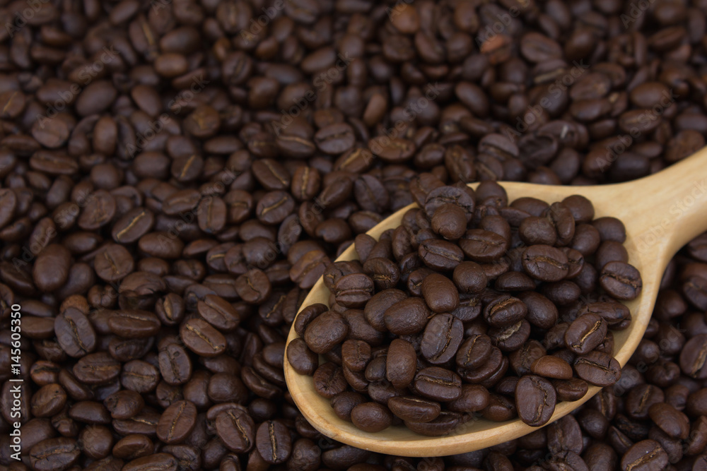 Coffee beans in wood ladle