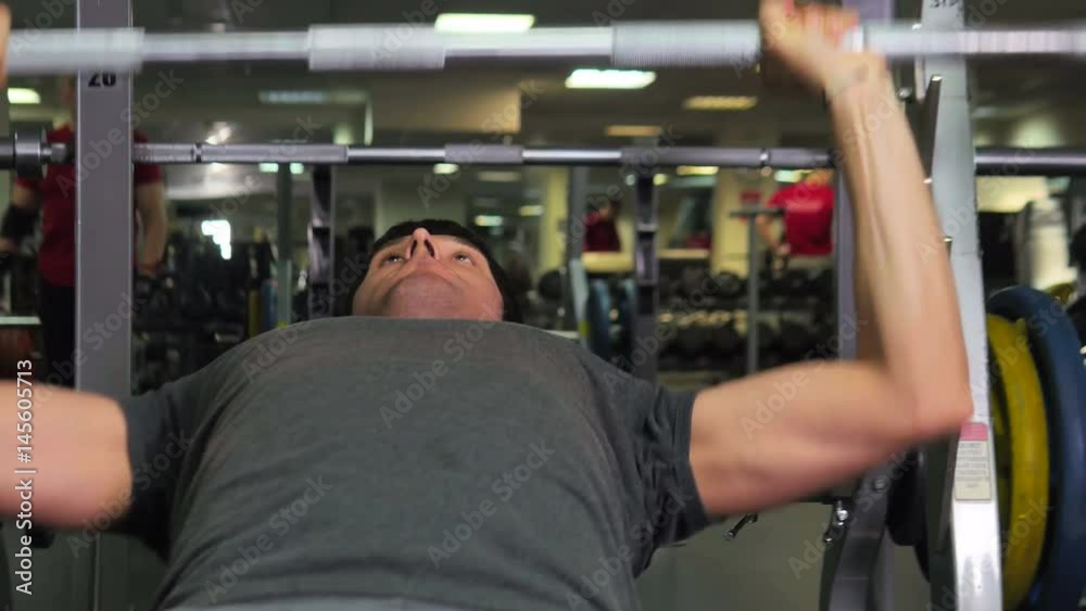 A Man is Doing an Exercise in Gym A Man is Doing an Exercise in Gym