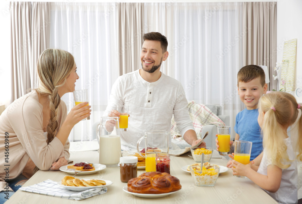 Happy family having breakfast on kitchen Happy family having breakfast on kitchen