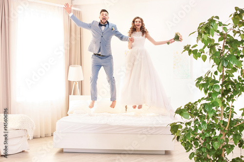 Happy wedding couple having...