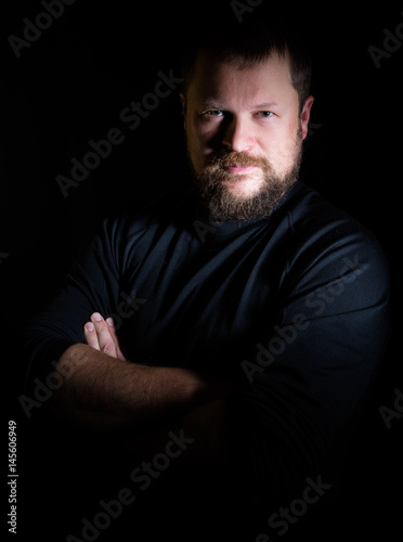 Solid bearded middle-aged man portrait