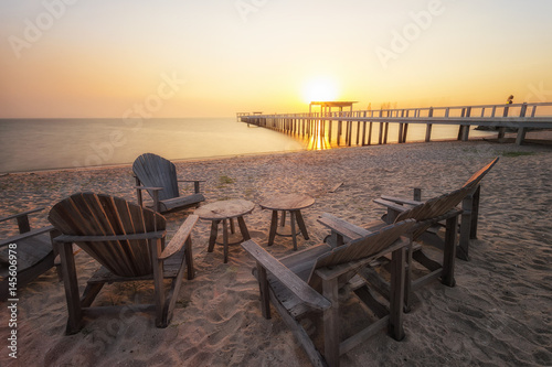 Wooden table beach front. Group of a chair and wooden table beach front in public area with warm sunshine. relax time © JKOP82