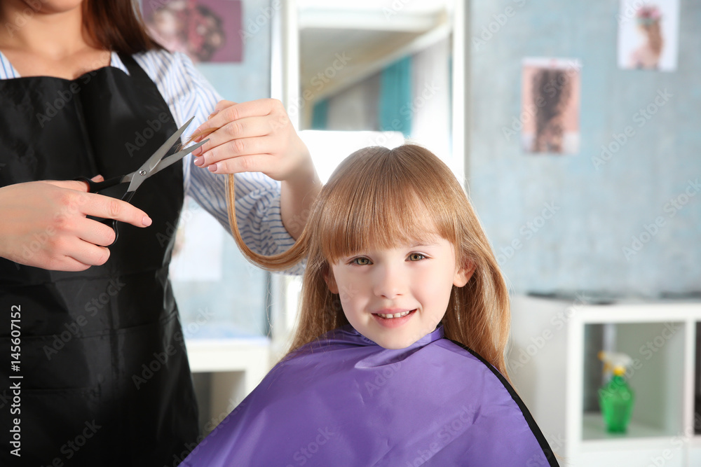 Cute little girl in hairdressing salon Cute little girl in hairdressing salon