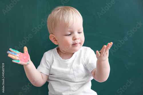 Cute little boy with hands ...