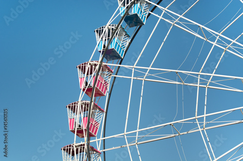 Colorful Amusement Park Big Wheel on Clear Blue Sky
