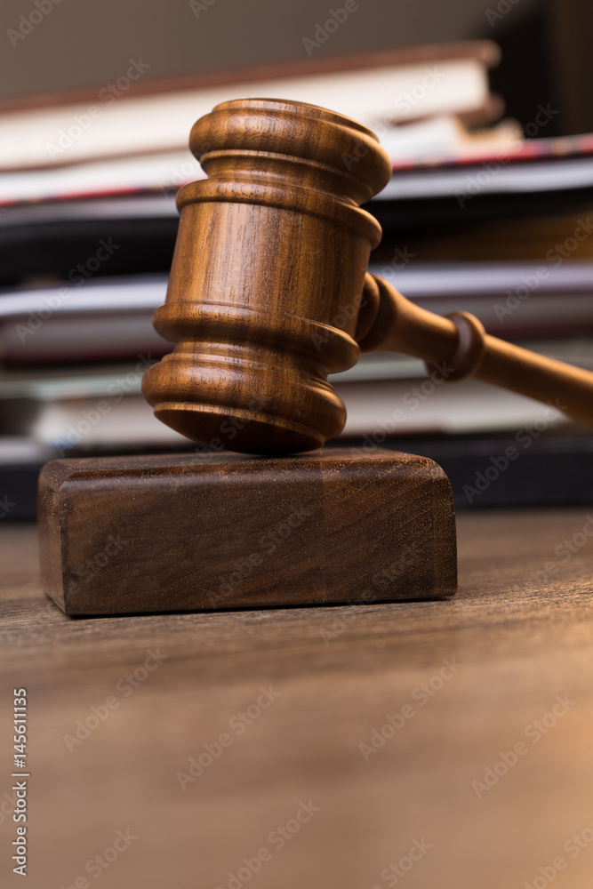 Photography of hammer against documents Photography of hammer against documents