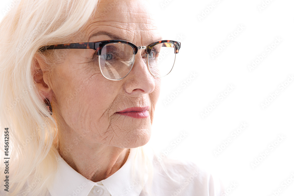 Glance of serious old lady