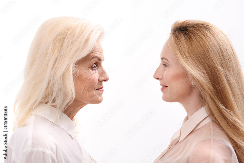 Mature female person front of young daughter Mature female person front of young daughter