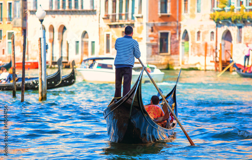 Tela Gondolier in gondola. Venice