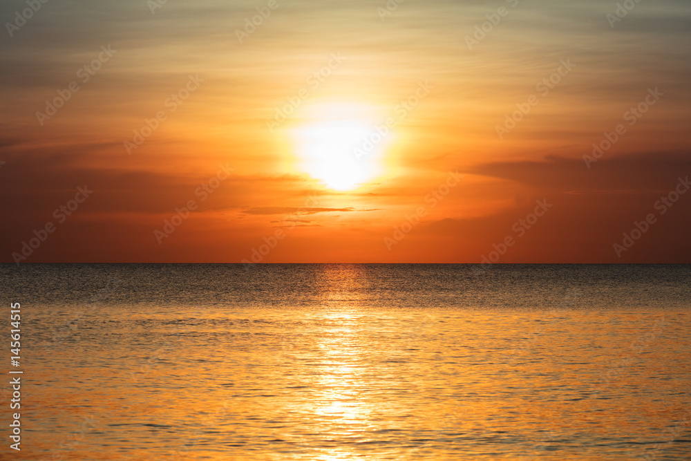 sunset over the tranquil ocean