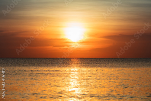 sunset over the tranquil ocean