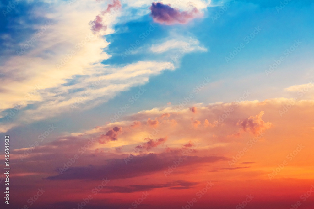 Beautiful dramatic sunset sky with red orange pink purple colors. Natural background