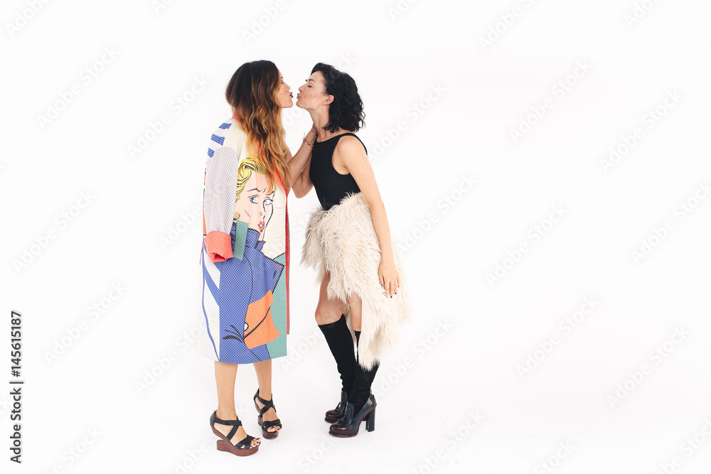 Full body portrait of young women, isolated over white background Full body portrait of young women, isolated over white background