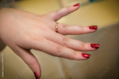 Close-up of a bride s hand showing wedding ring