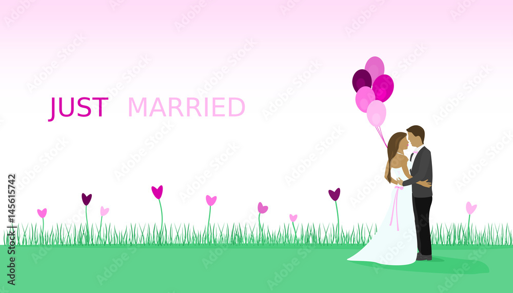 Just married - wedding. Bridal couple in a field full of heart flowers and with balloons.