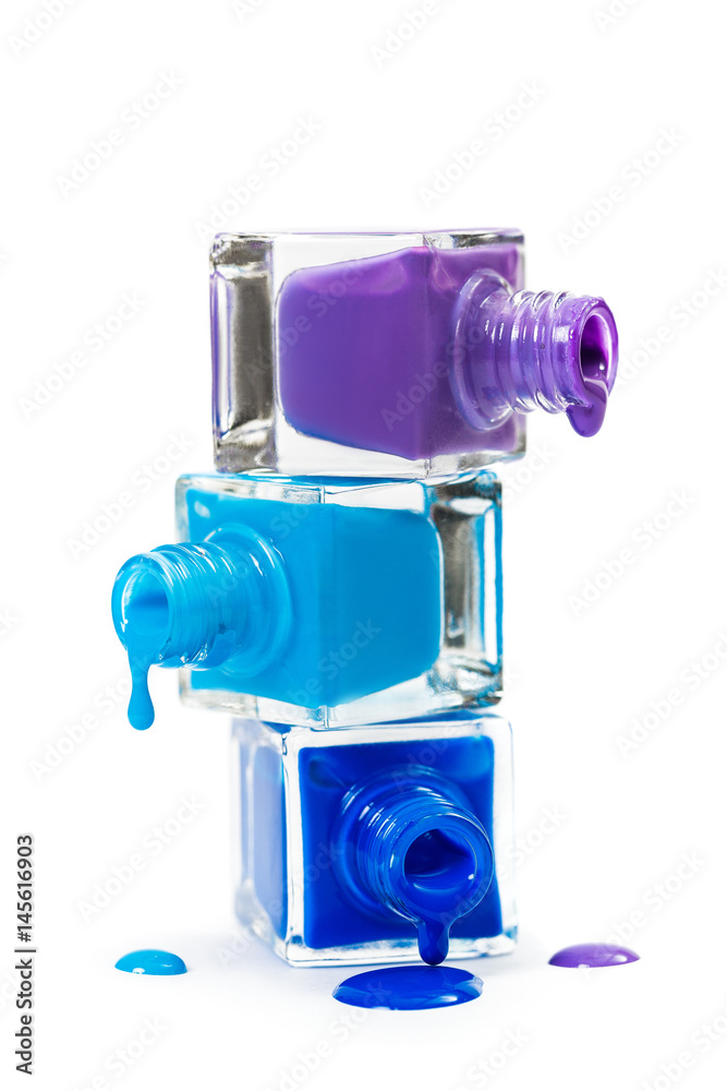 Stack of blue nail polish isolated on white background Stack of blue nail polish isolated on white background